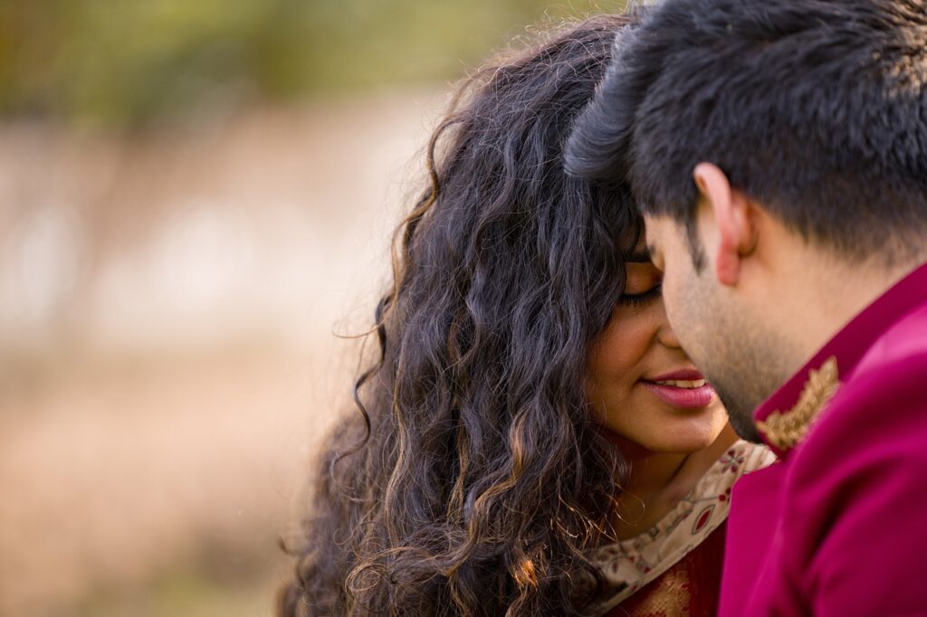 Romantic couple posing in a scenic outdoor location for their pre-wedding photoshoot."